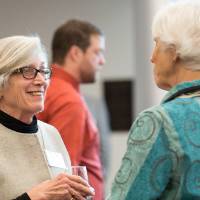 Two women talking to each other at the event.